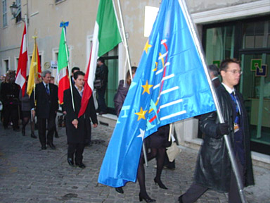 the parade lines up with the AEHT flag to the fore.