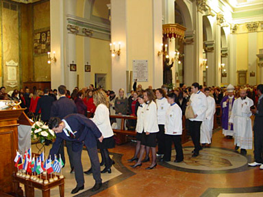 The students line up to lay down a flag for each country