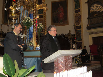 Don Tommaso Capriotti addresses his congregation