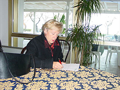 Madre Noėl jots down her ideas. Madre Noėl jots down her ideas.