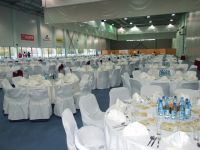 The enormous dining hall with its beautifully laid tables awaiting the guests