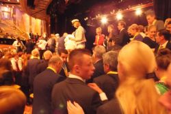 A good-natured throng of those wishing to grab a ‘25th Anniversary Polo Shirt’