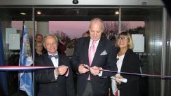 A solemn moment – the ribbon is cut to open the exhibition to all visitors