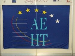 The poster and the AEHT flag tempt the public to visit the exhibition.